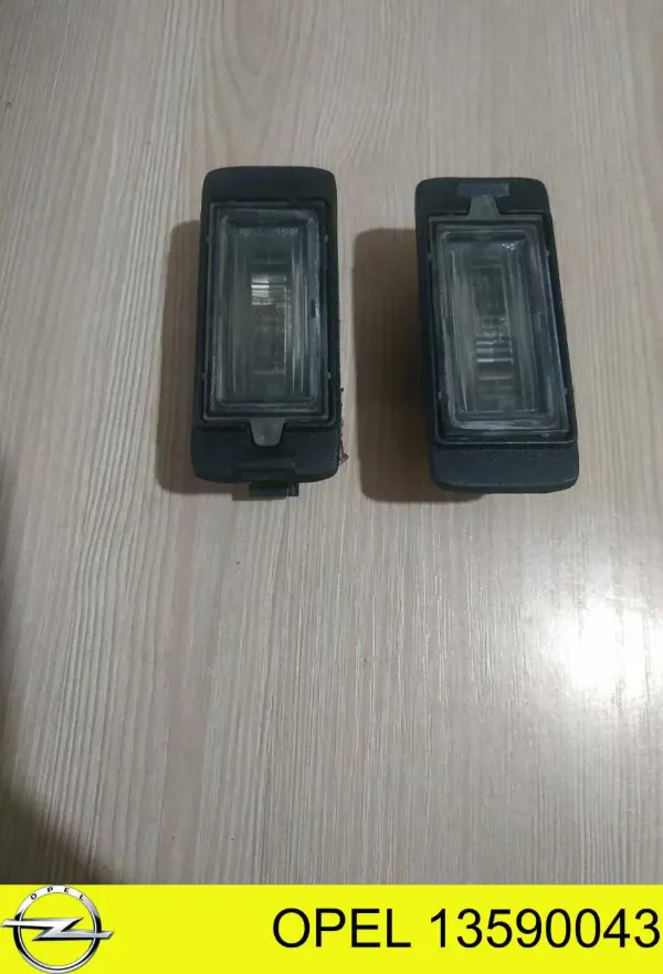 Фонарь подсветки номерного знака 13590043 Opel