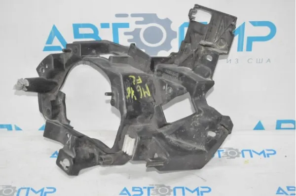 Кронштейн крепления противотуманной фары левой G46L51694 Mazda