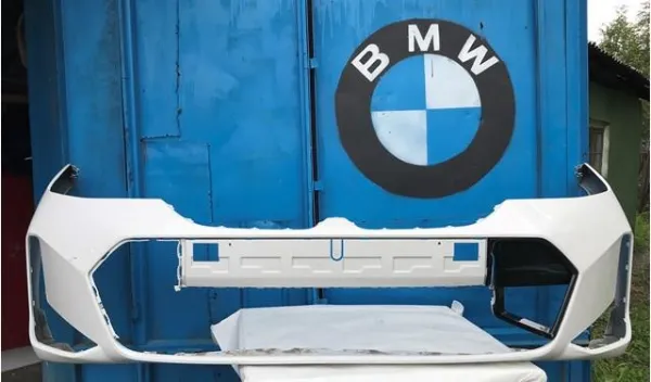 Передний бампер 51115A69619 BMW